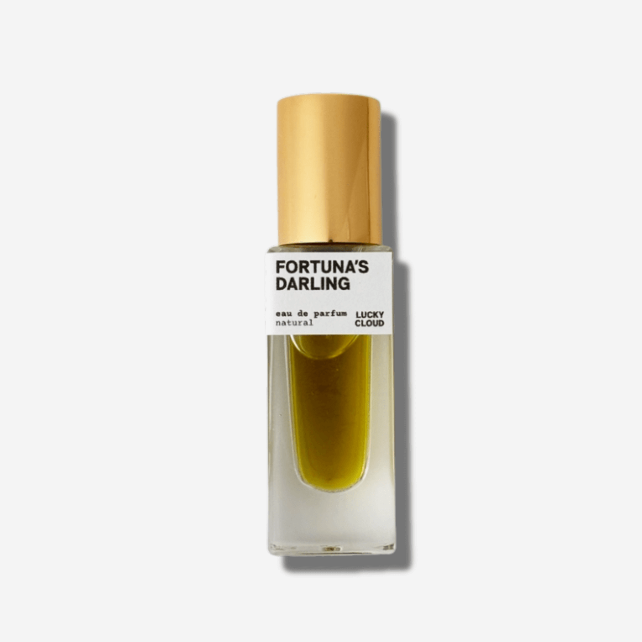 Fortuna's Darling natural perfume bottle with golden cap, evoking vibrant citrus and amber musk.